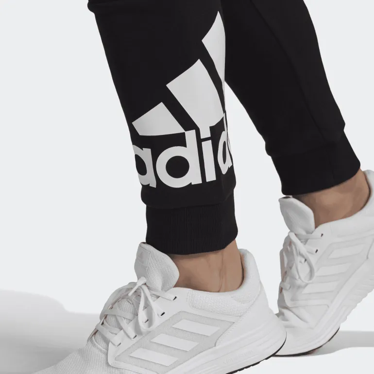 PANTALONI SPORTIVI DA UOMO ADIDAS ESSENTIALS IN FRENCH TERRY NERI CON POLSINO