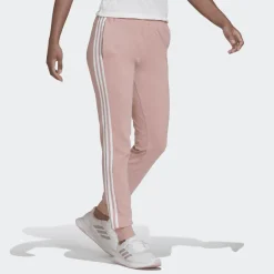 PANTALONI SPRTIVI DA DONNA ADIDAS ESSENTIALS ROSA CON STRISCE BIANCHE