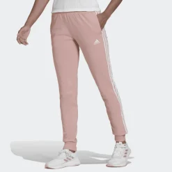 PANTALONI SPRTIVI DA DONNA ADIDAS ESSENTIALS ROSA CON STRISCE BIANCHE